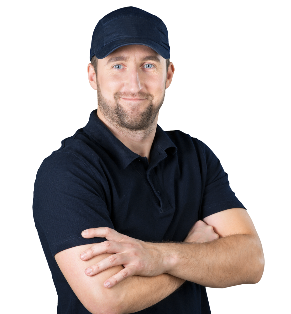 Man with blue eyes wearing a navy cap and polo, arms crossed, smiling.