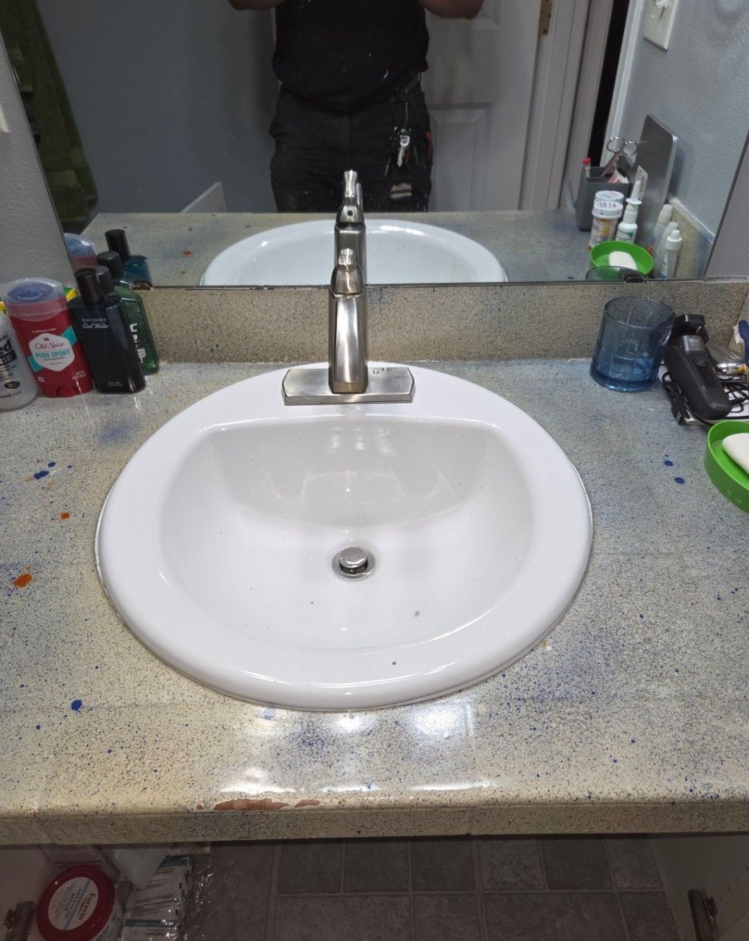 A HYDRO-BLOK shower base installed in a framed bathroom with drain pipe centered and instructions on the surface.
