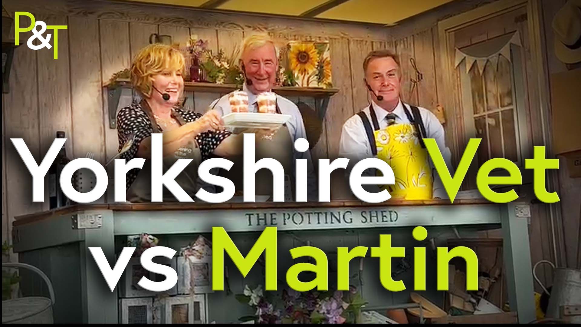 Jill Fish, Peter Wright & Martin Fish on the 'Potting Shed Stage' at the Great Yorkshire Show - in front are the words 'Yorkshire Vet vs Martin'