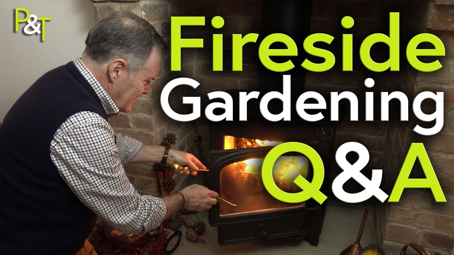 Martin bends down to stoke the wood burning stove there's a fire roaring in it. The text Fireside Gardening Q and A in green and white over the top.