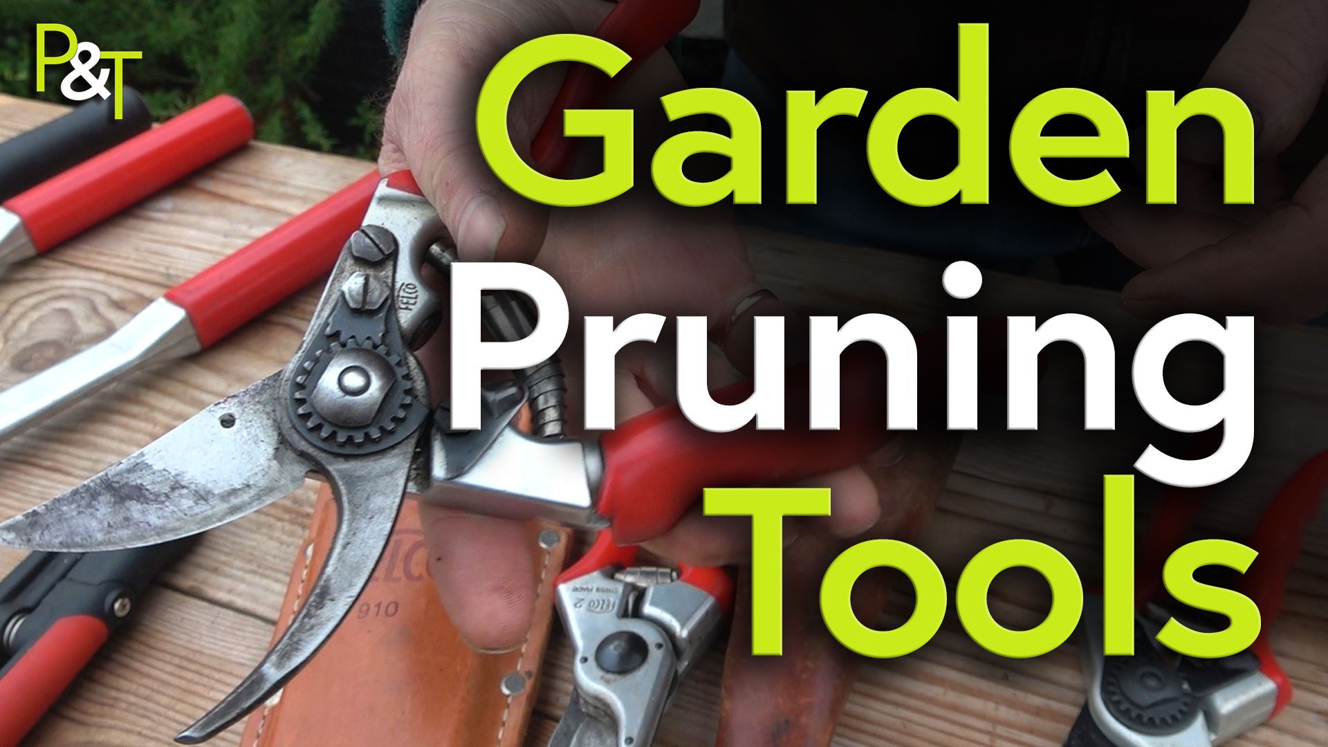 closeup of a bench with secateurs of different types. there are some bypass and some anvil style, they both have red handles - the image darkens to the right and over the top of this part is the large green and white text Garden Pruning Tools