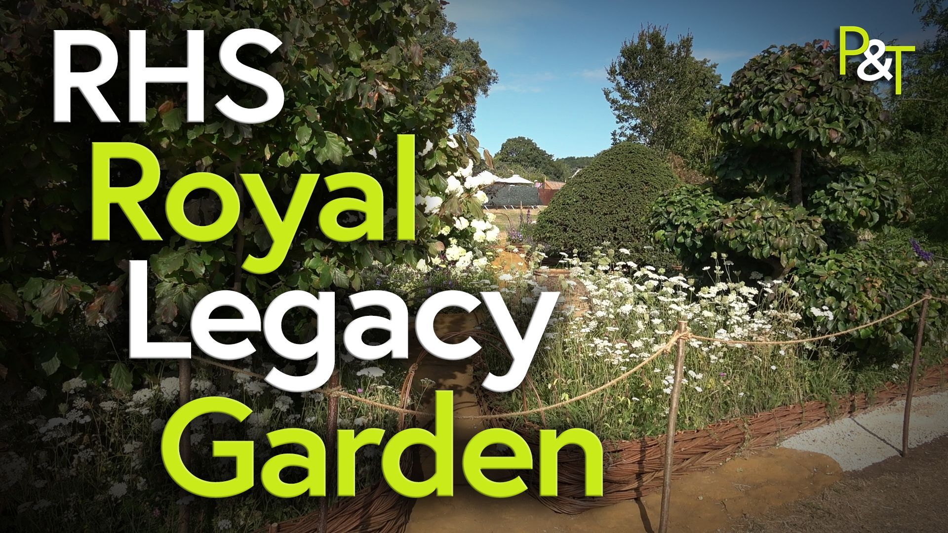 Wide shot of a show garden looking over a roped off section from the path. the garden has all sorts of cottage garden flowering plants. The Text in green and white states RHS Royal Legacy Garden.