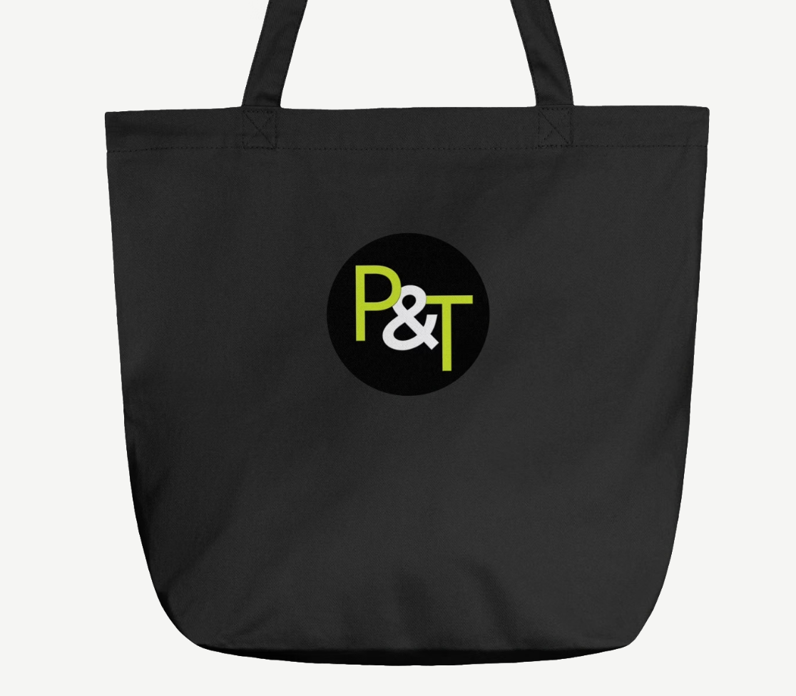 a black tote bag on a white background with the Pots and Trowels logo P and T in green and white on a black circle