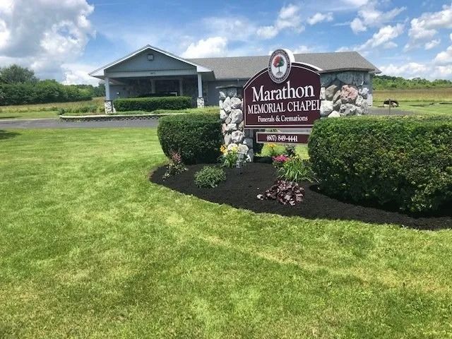 Marathon Baptist Chapel sign in front of a church building and manicured lawn