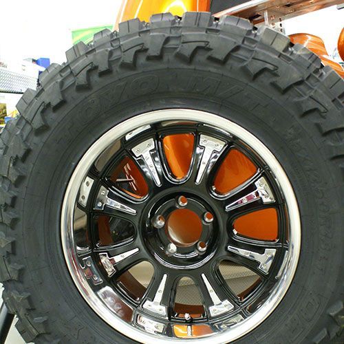 A close up of a tire with a chrome rim