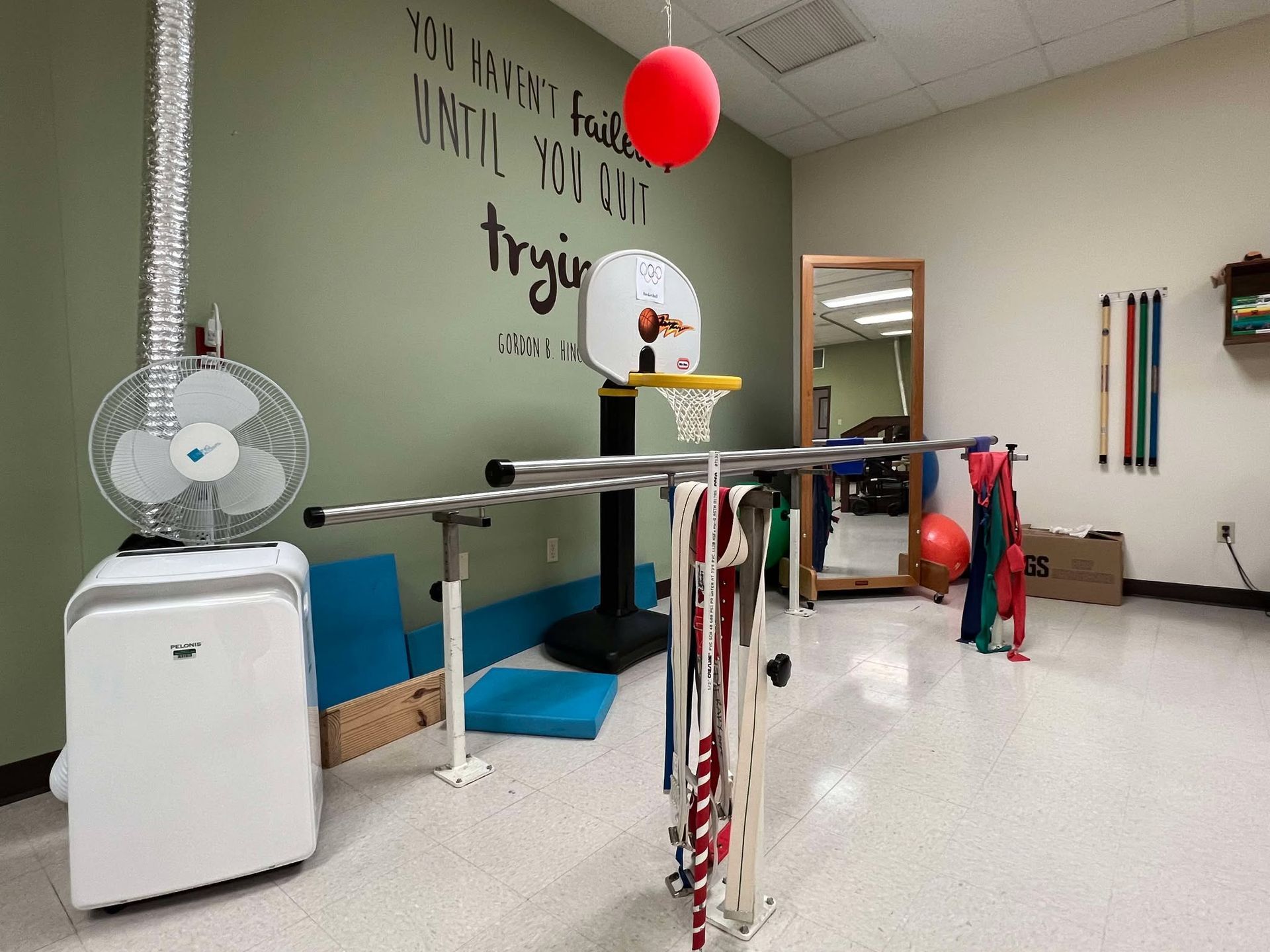 A room with a basketball hoop and a sign that says trying