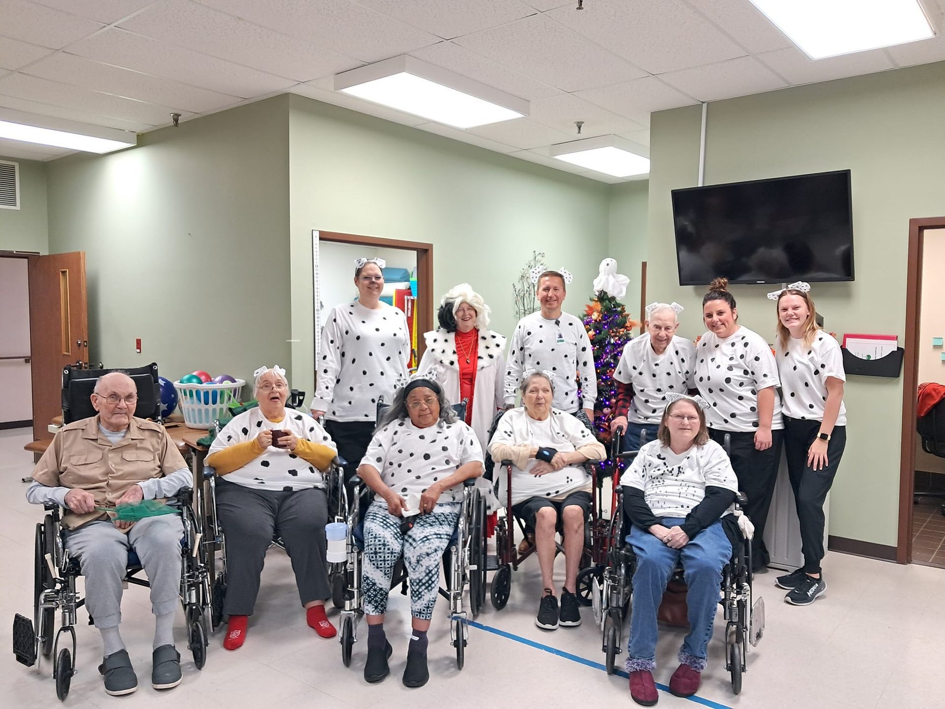 A group of people in wheelchairs are posing for a picture.