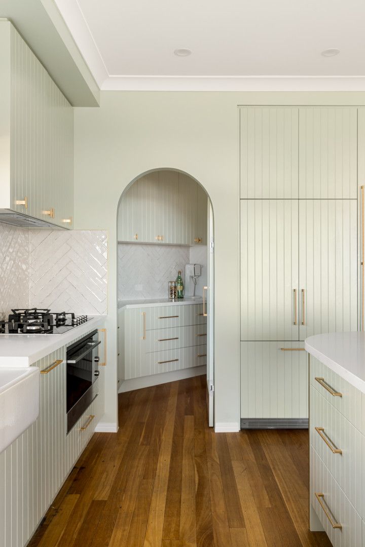 A Kitchen With a Dining Table and Chairs and a Kitchen Island — CK Cabinetry in Coolum Beach, QLD
