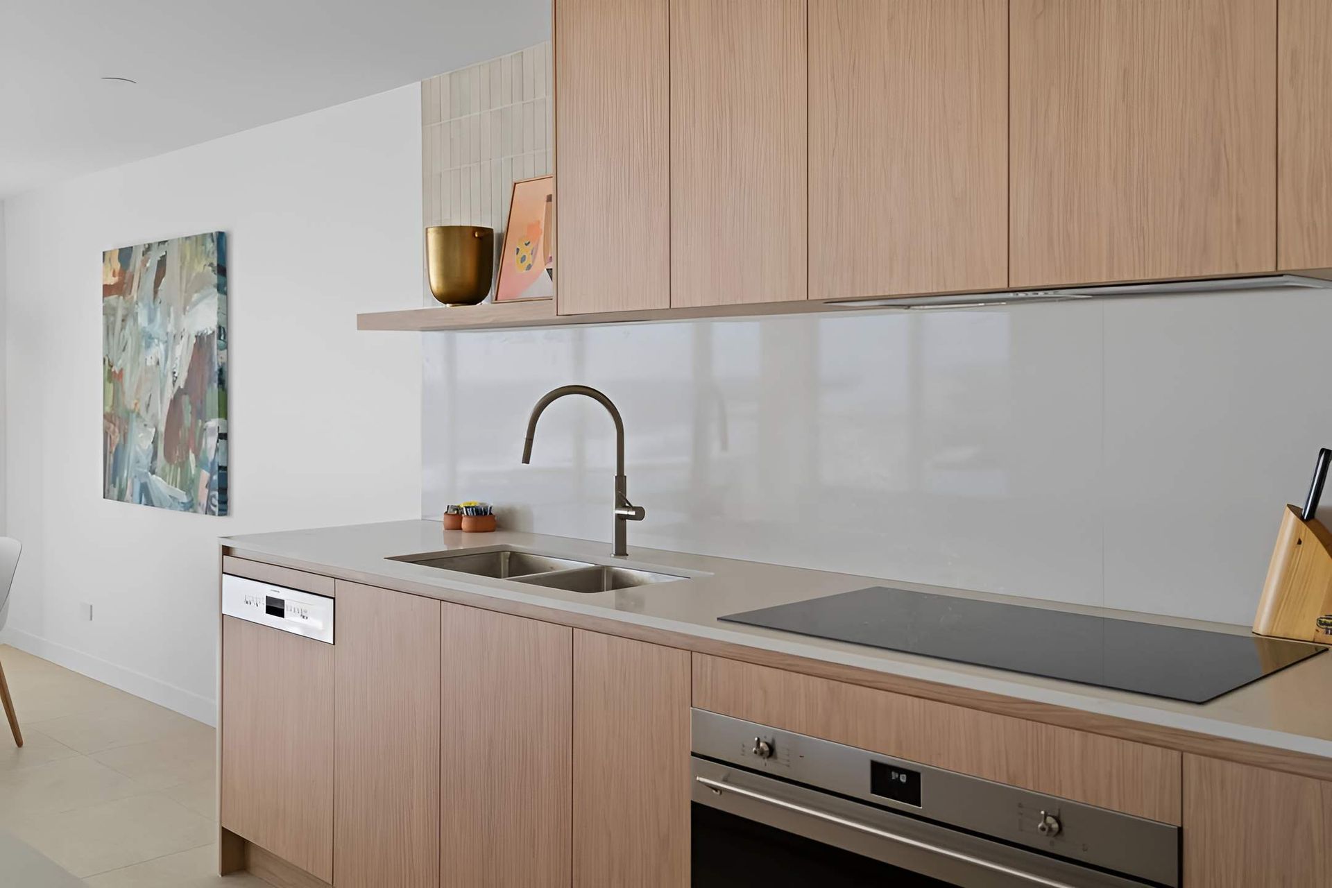A Kitchen With Wooden Cabinets, Stainless Steel Appliances — CK Cabinetry in Maroochydore, QLD