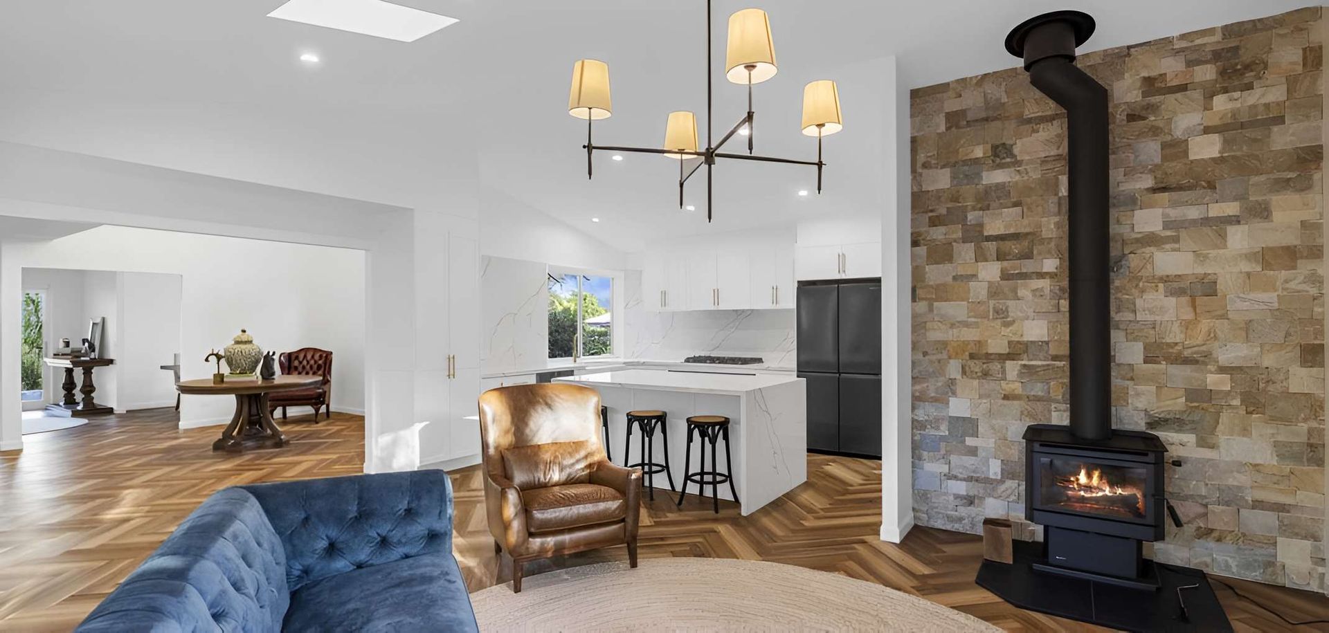 A Living Room With a Blue Couch, Chairs — CK Cabinetry in Coolum Beach QLD