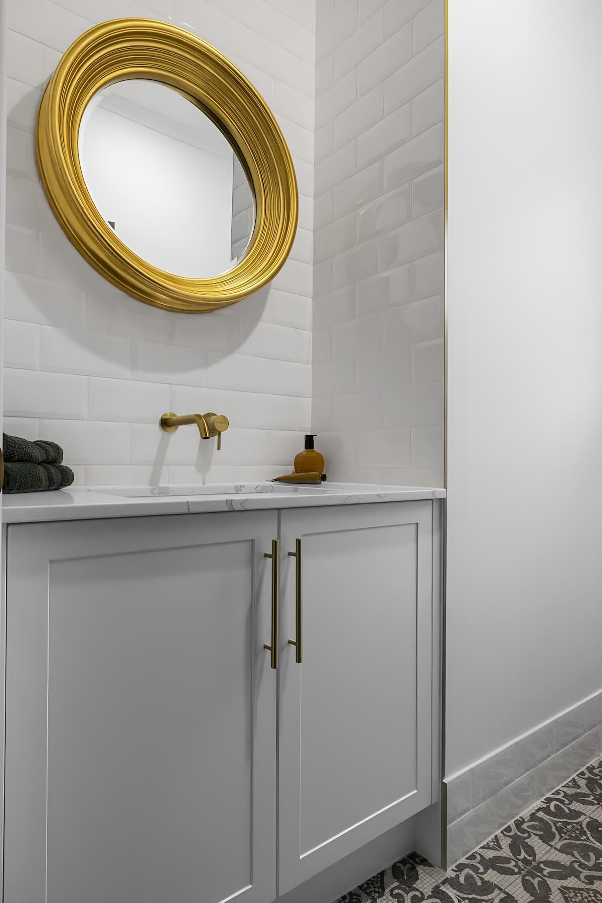 A Bathroom With a Sink, Mirror and Cabinets — CK Cabinetry in Coolum Beach, QLD