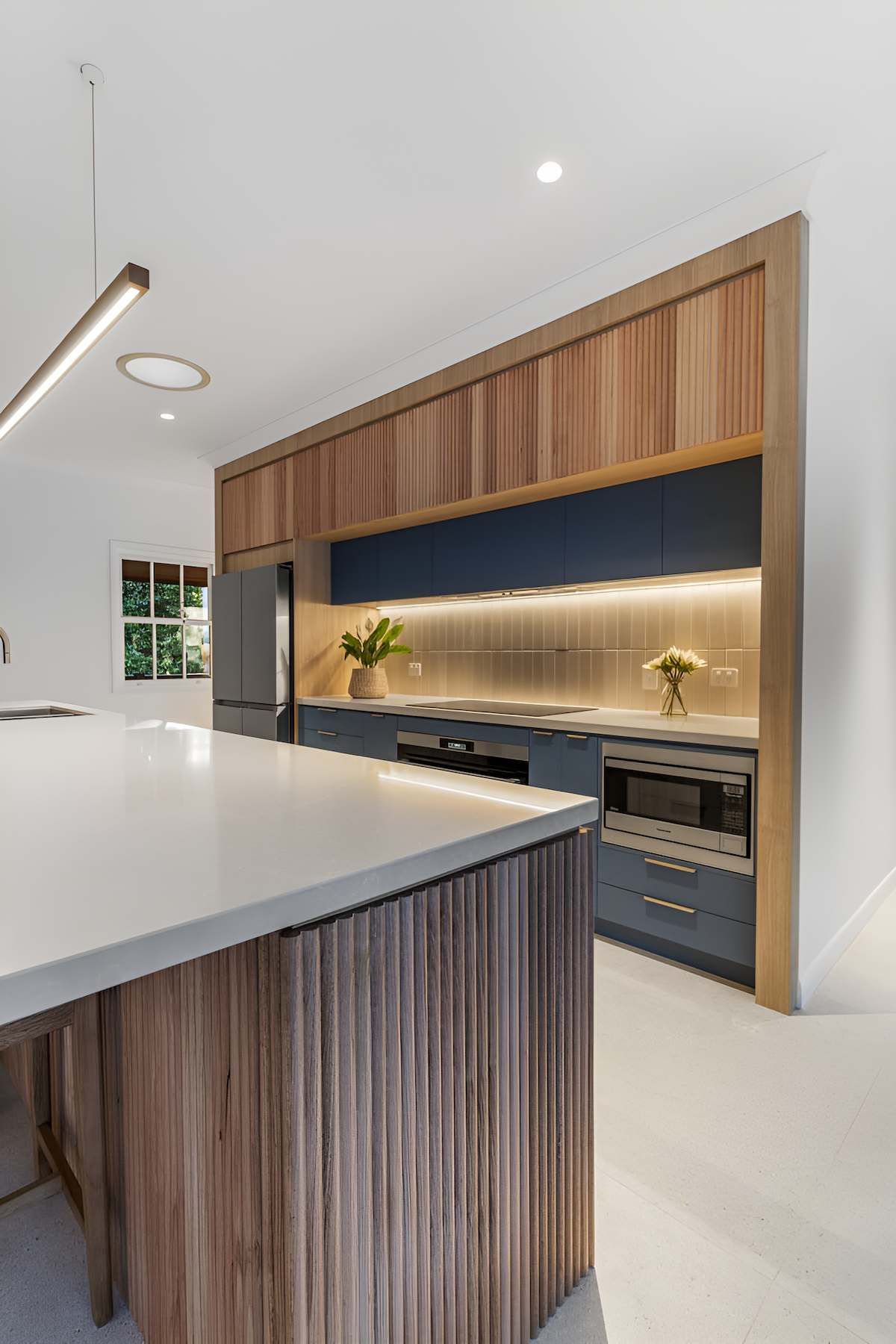A Kitchen With a Large Island in the Middle of the Room — CK Cabinetry in Coolum Beach, QLD