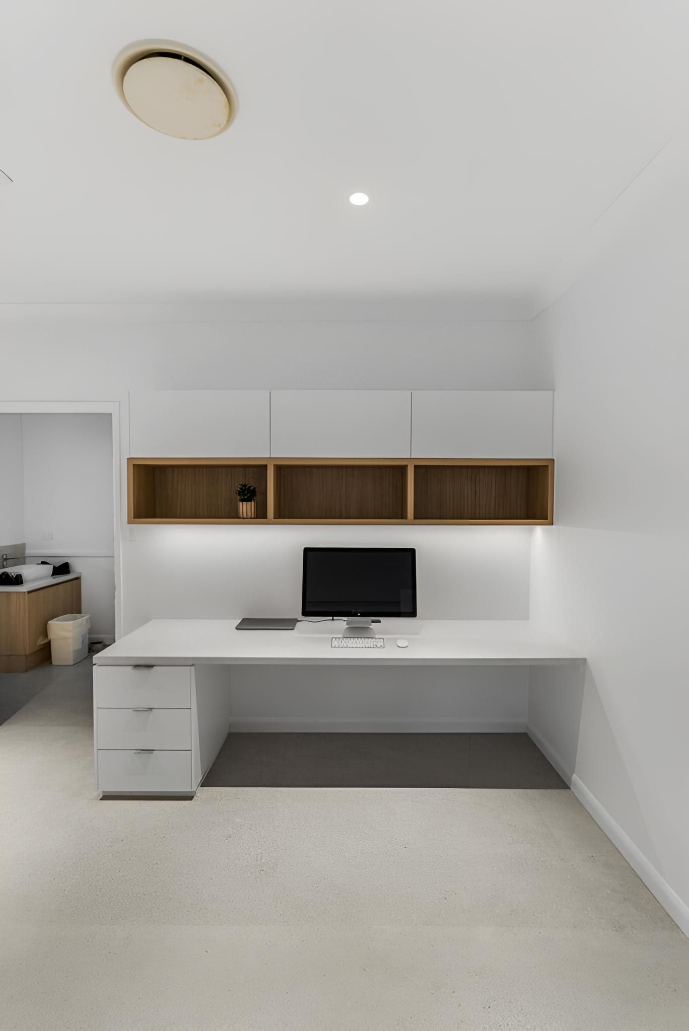 A White Desk With a Computer on It in a Room — CK Cabinetry in Coolum Beach, QLD
