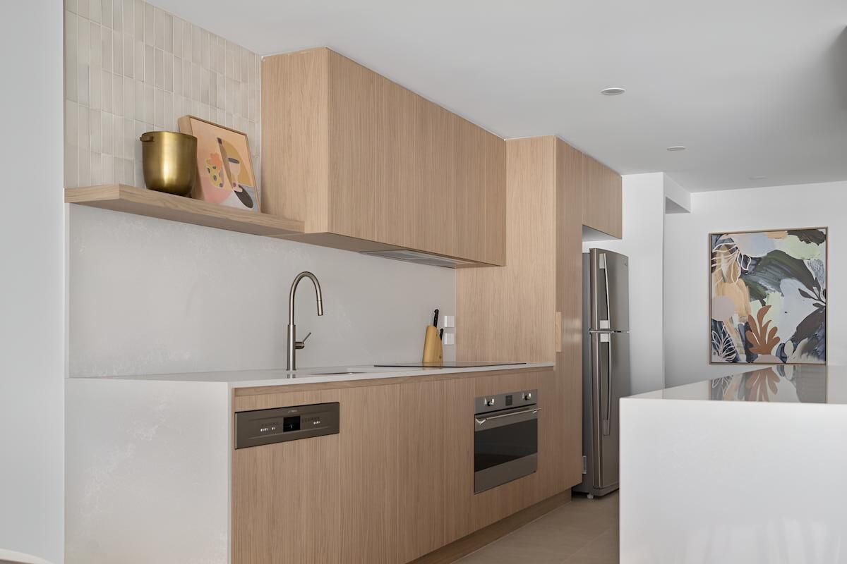 A Kitchen With Wooden Cabinets, Stainless Steel Appliances — CK Cabinetry in Coolum Beach, QLD