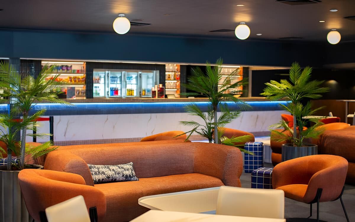 A Living Room With a Couch, Tables and a Bar — CK Cabinetry in Coolum Beach, QLD