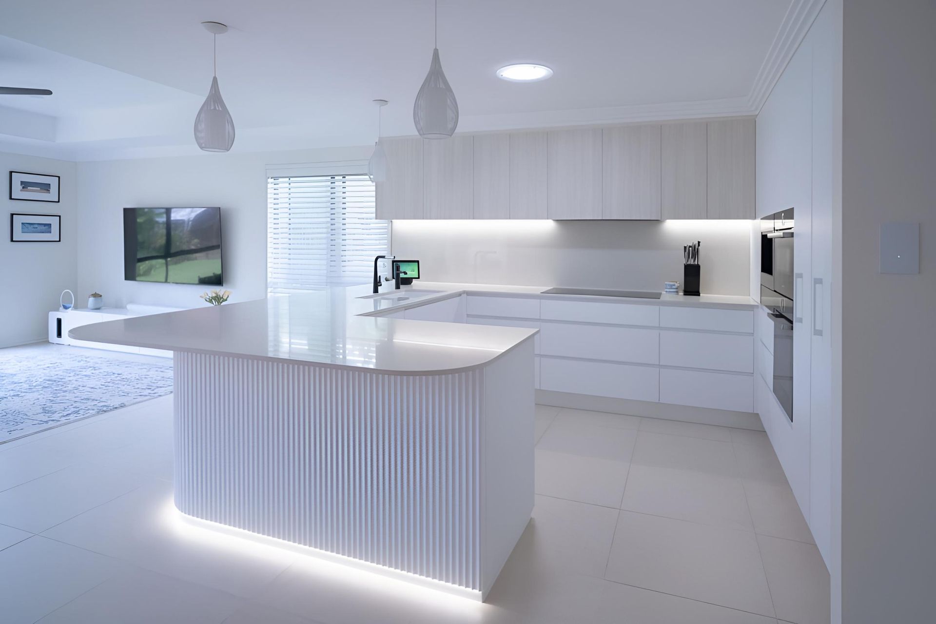 A Kitchen With White Cabinets and a Large Island in the Middle — CK Cabinetry in Coolum Beach, QLD