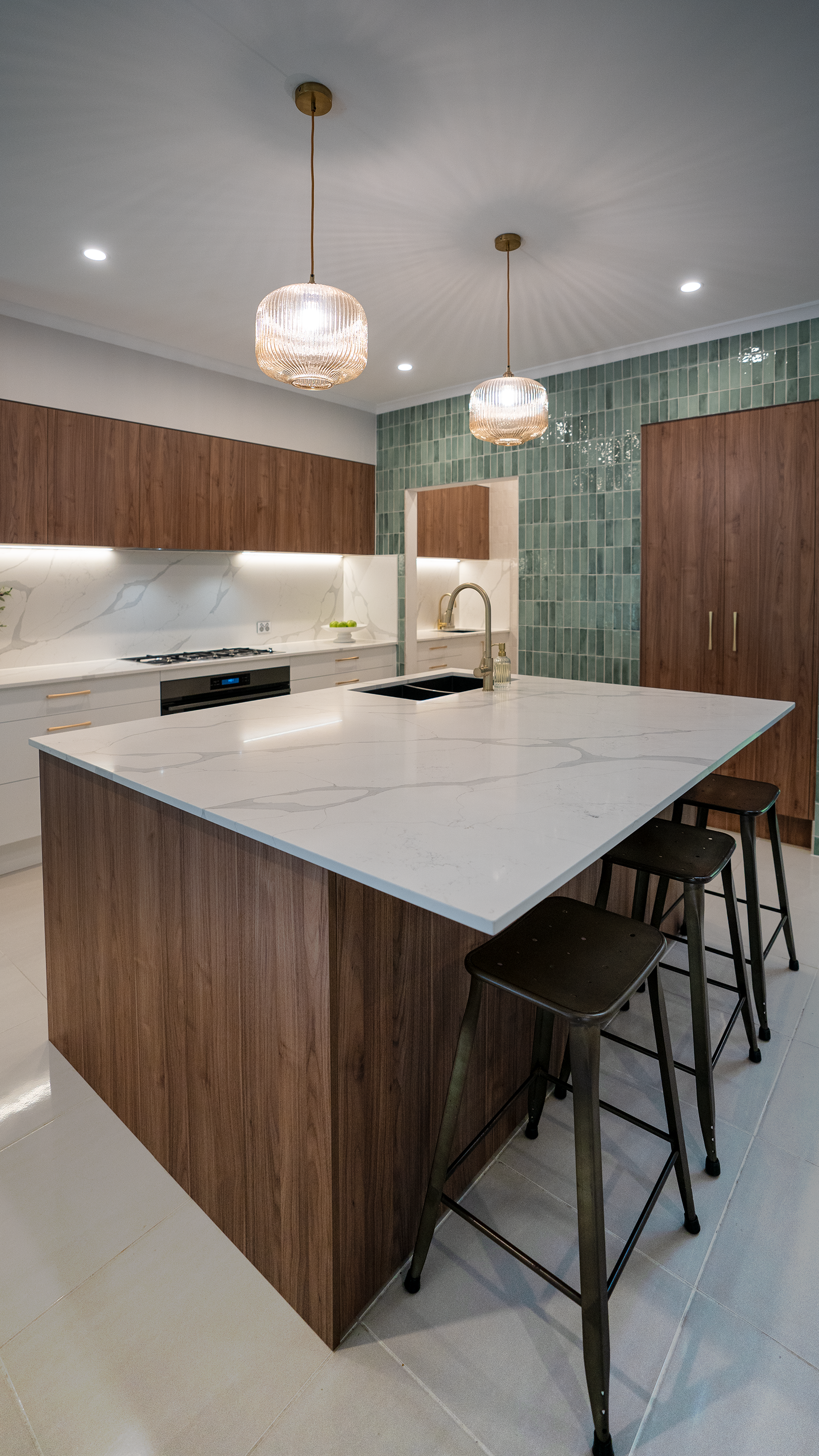 A Kitchen sunshine coast With White Cabinets and Marble Counter Tops — CK Cabinetry in Sunshine coast, QLD