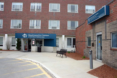 A brick building with a blue sign that says head general for children