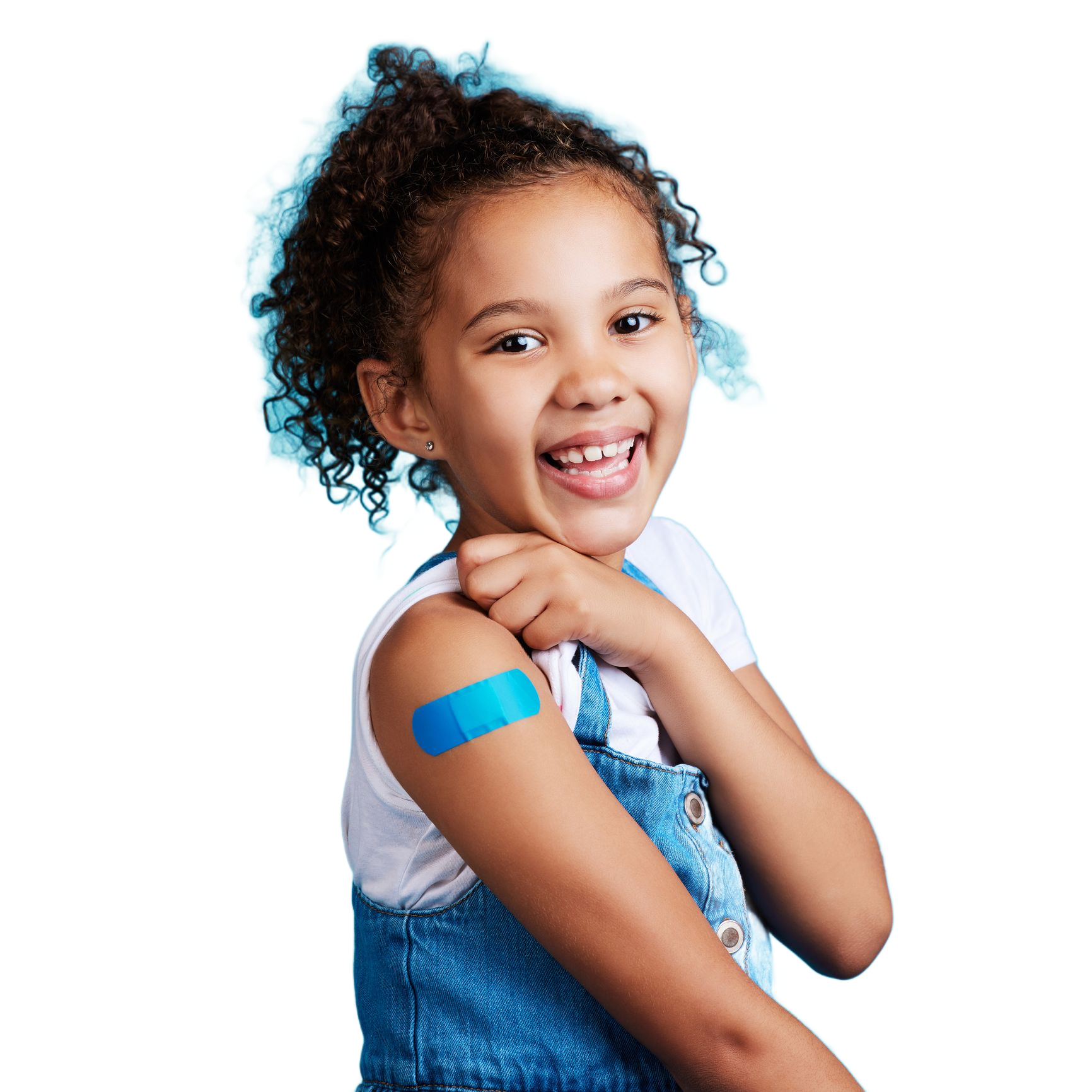 Smiling child with blue bandage on upper arm holding a stuffed toy against a white background