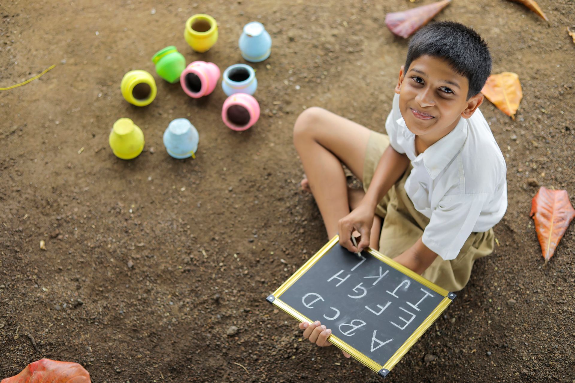 Boy playing with a chalkboard game