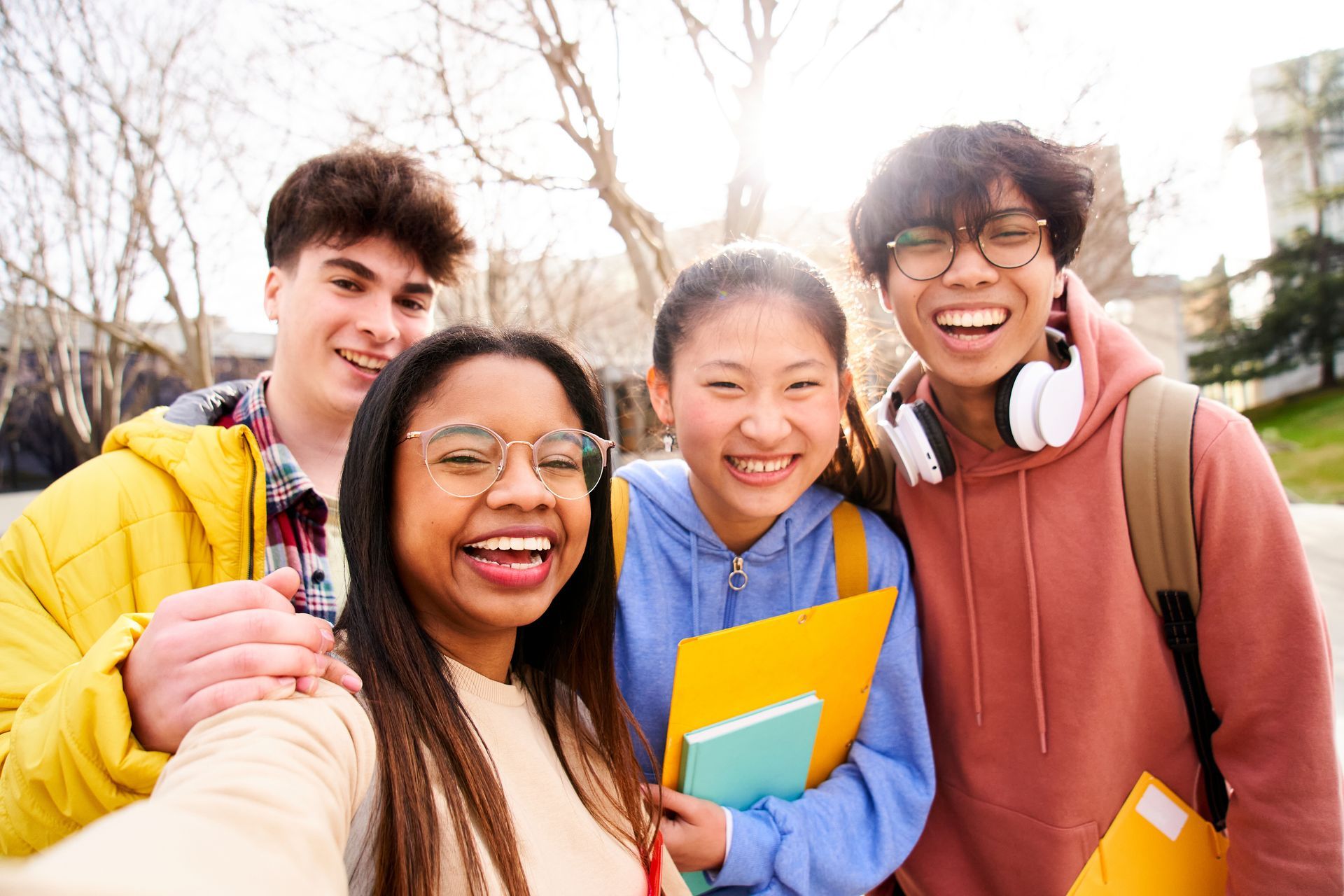 A group of young people are taking a selfie together.