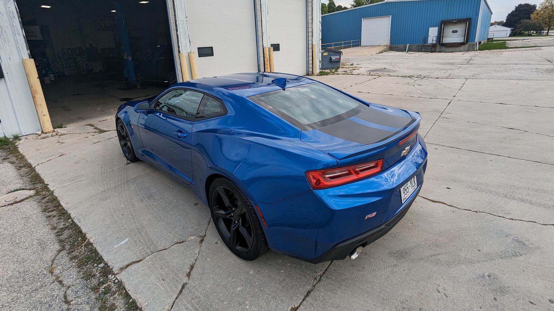 Blue sports car with a fresh ceramic coating outside Tidy Car in Sheboygan, Wisconsin