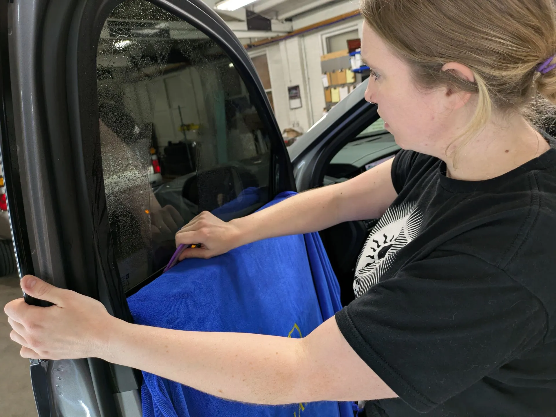Professional window tint installation at Tidy Car in Sheboygan, Wisconsin