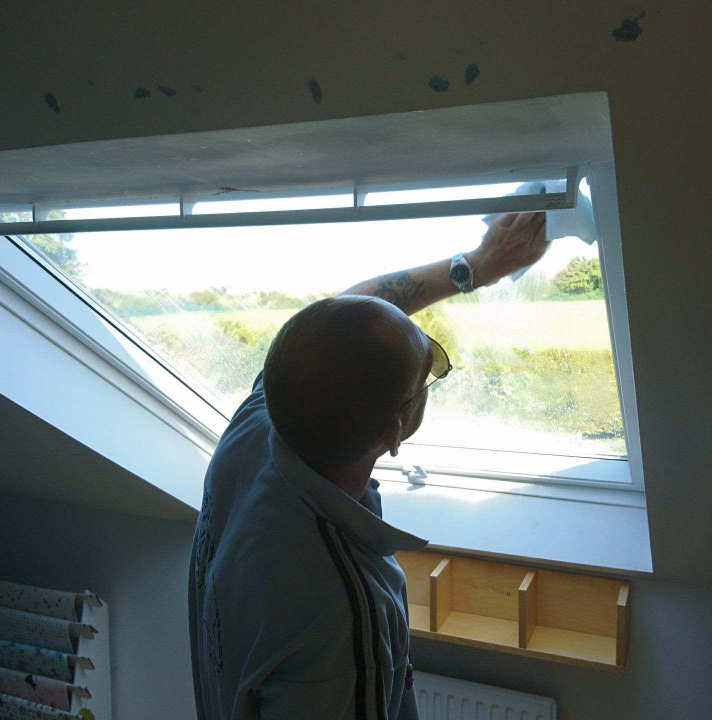 Cleaning down the frame and glass after installation.