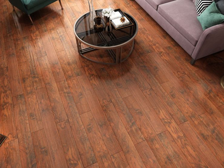 A living room with hardwood floors and a round coffee table.