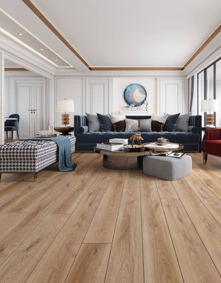 A living room with hardwood floors , a couch , chairs , ottomans and a coffee table.