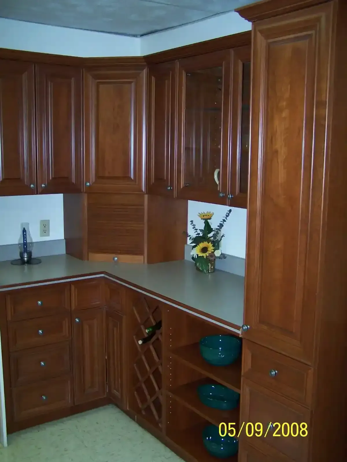 A kitchen with wooden cabinets and a stove top oven