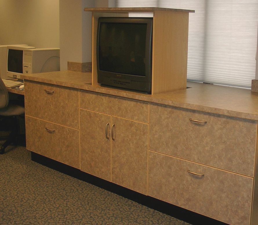 A tv is sitting on top of a wooden cabinet