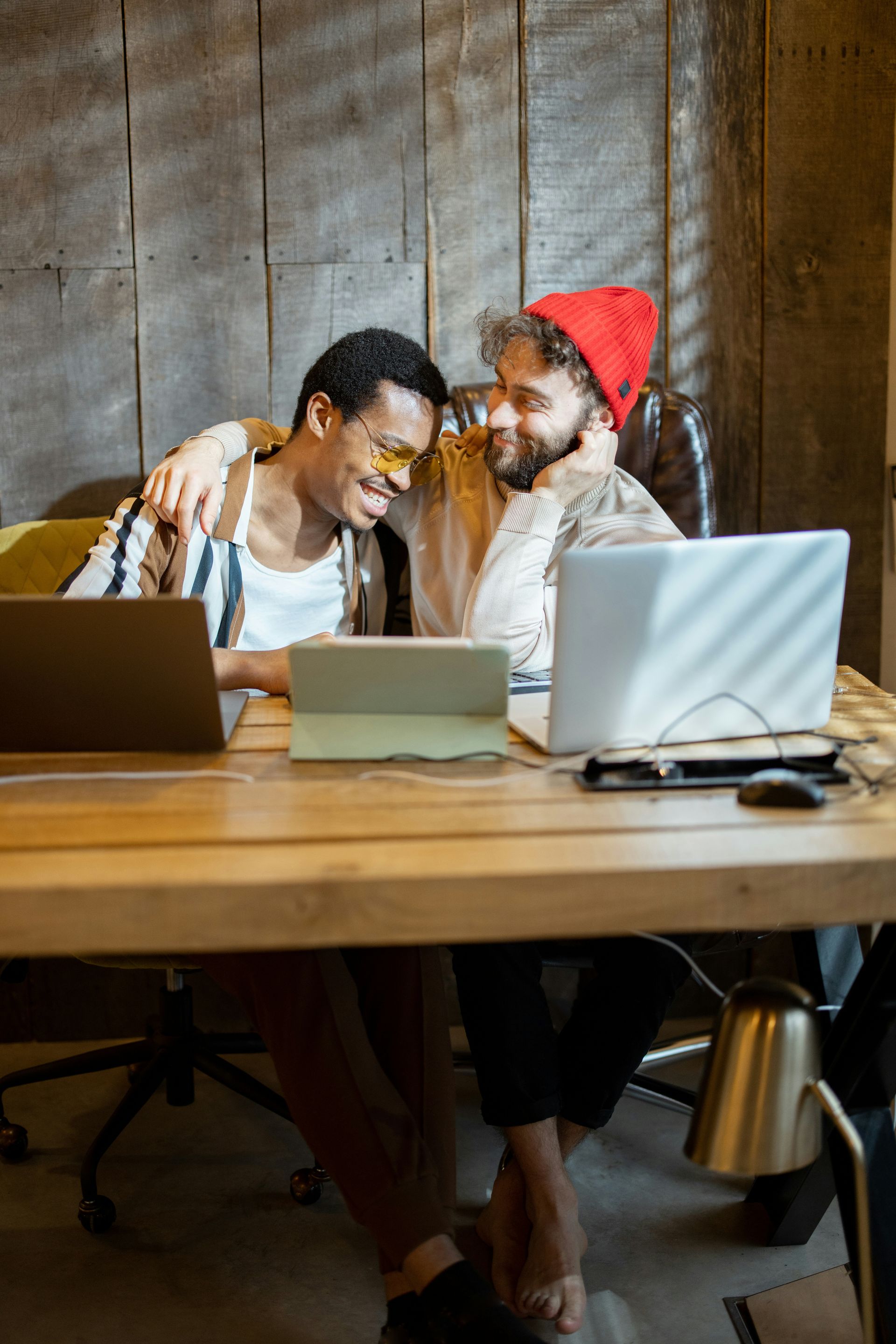 Couple sharing laughter and connection while working together, reflecting support and partnership in therapy with a Oakland couples therapist.