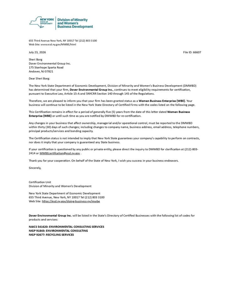Blurry photo of a formal letter on white paper with a logo and multiple paragraphs of text.