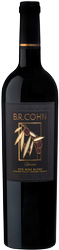 Black wine bottle with a BR Cohn label and gold vine design on a dark background