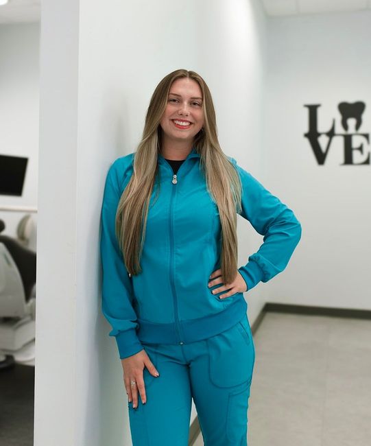 Dentist Near Me: Lizzie, front desk at our dental care facility