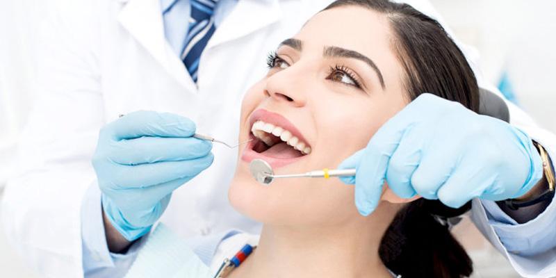Dentist in Chester, VA: Woman receiving a dental exam