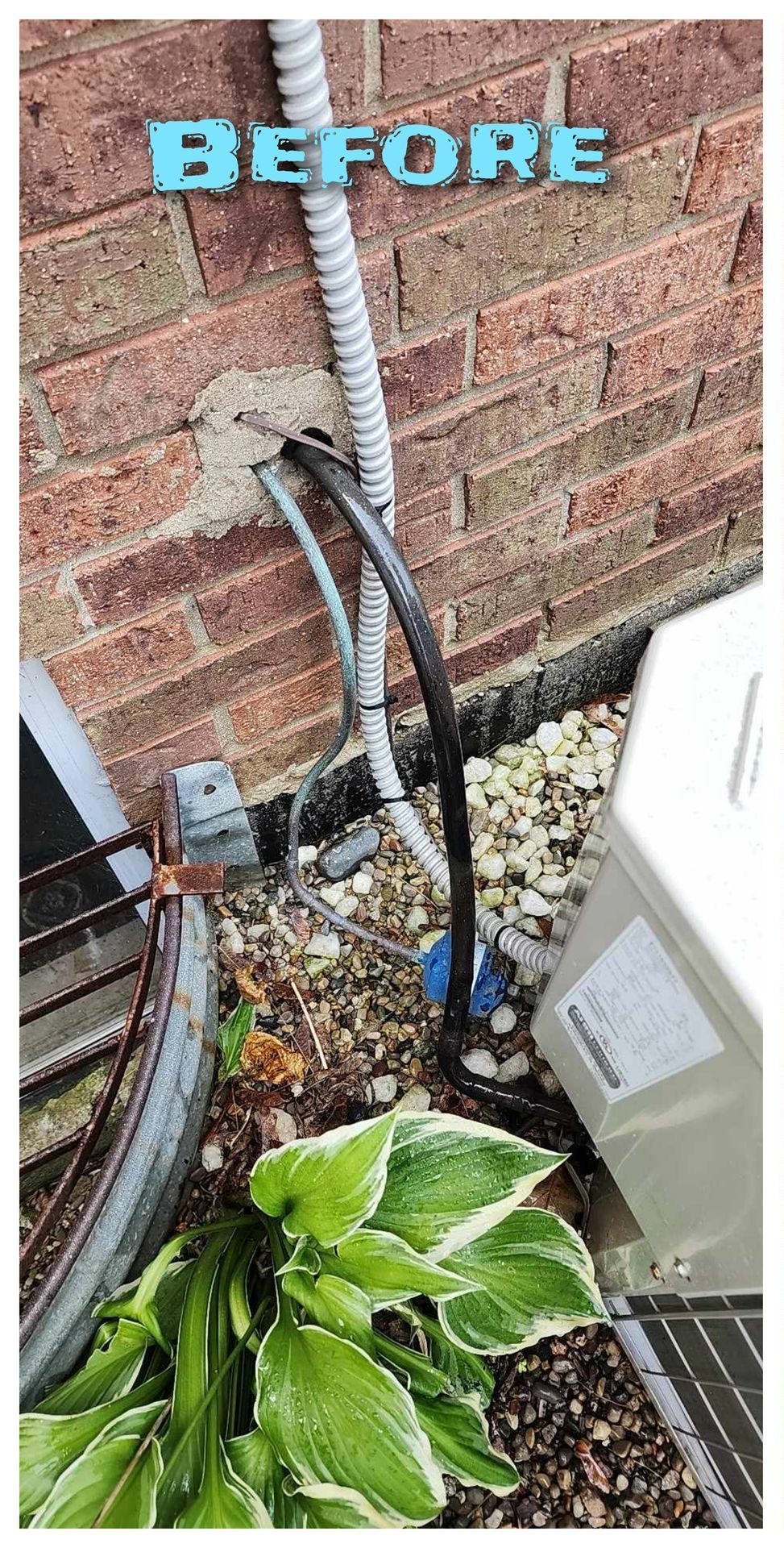 A picture of a brick wall with a hose attached to it.