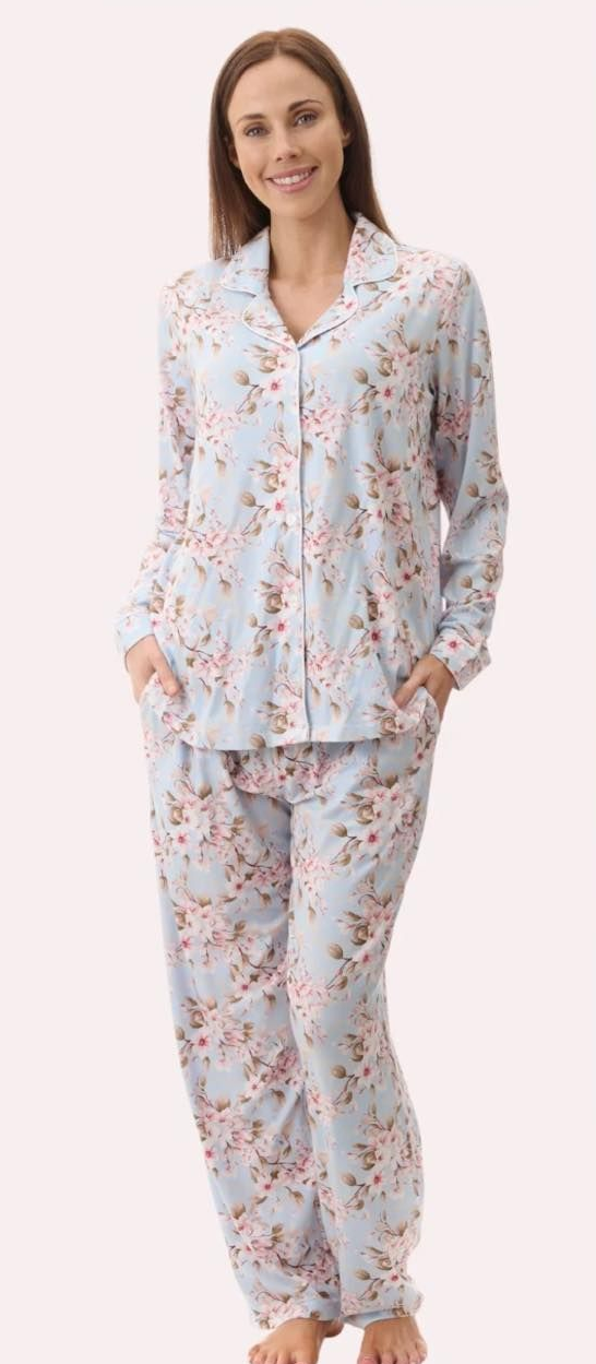 A Person Smiling While Wearing a Light Blue, Floral-patterned Long-sleeve Pajama Set — La Bra Boutique in Rockhampton, QLD