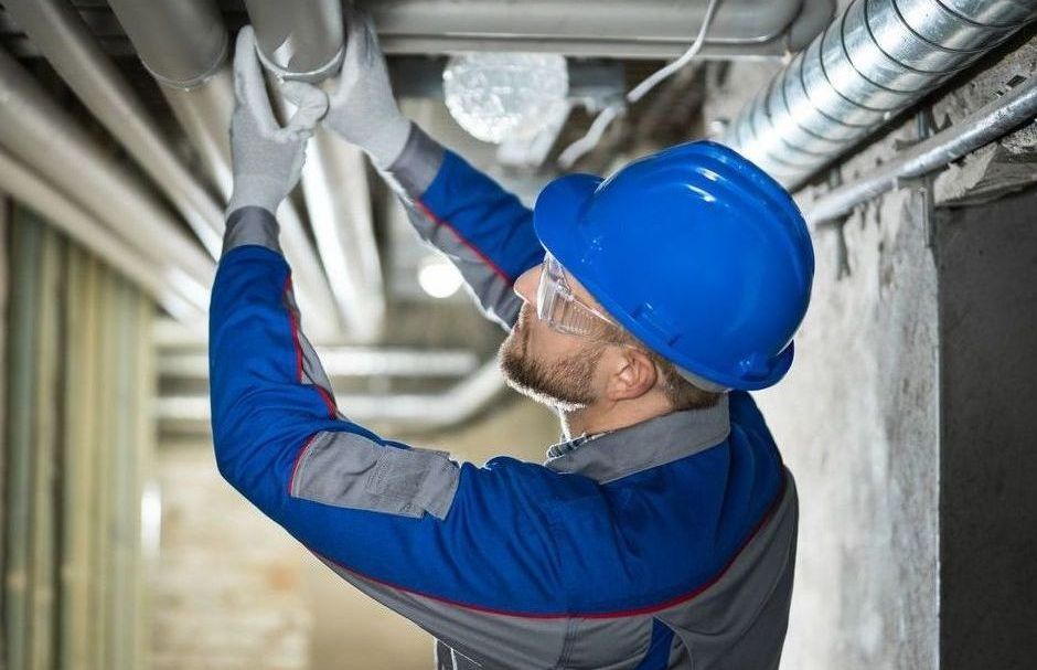 HVAC Specialist Working On A Compressor