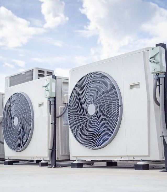 HVAC Specialist Working On A Compressor