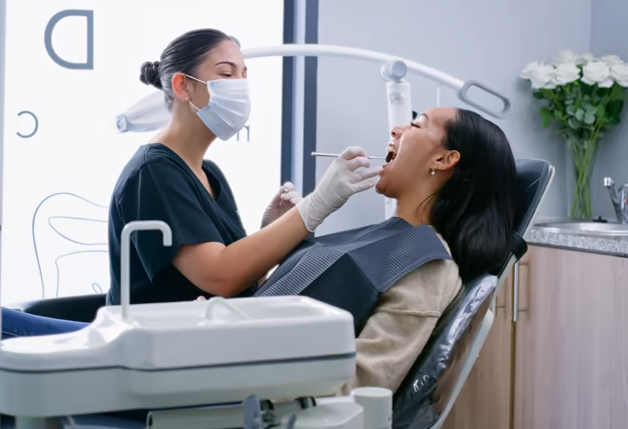 Dentist examining patient during dental checkups