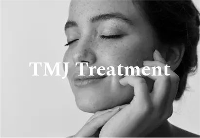Woman holding face near jaw; TMJ Treatment text overlay.