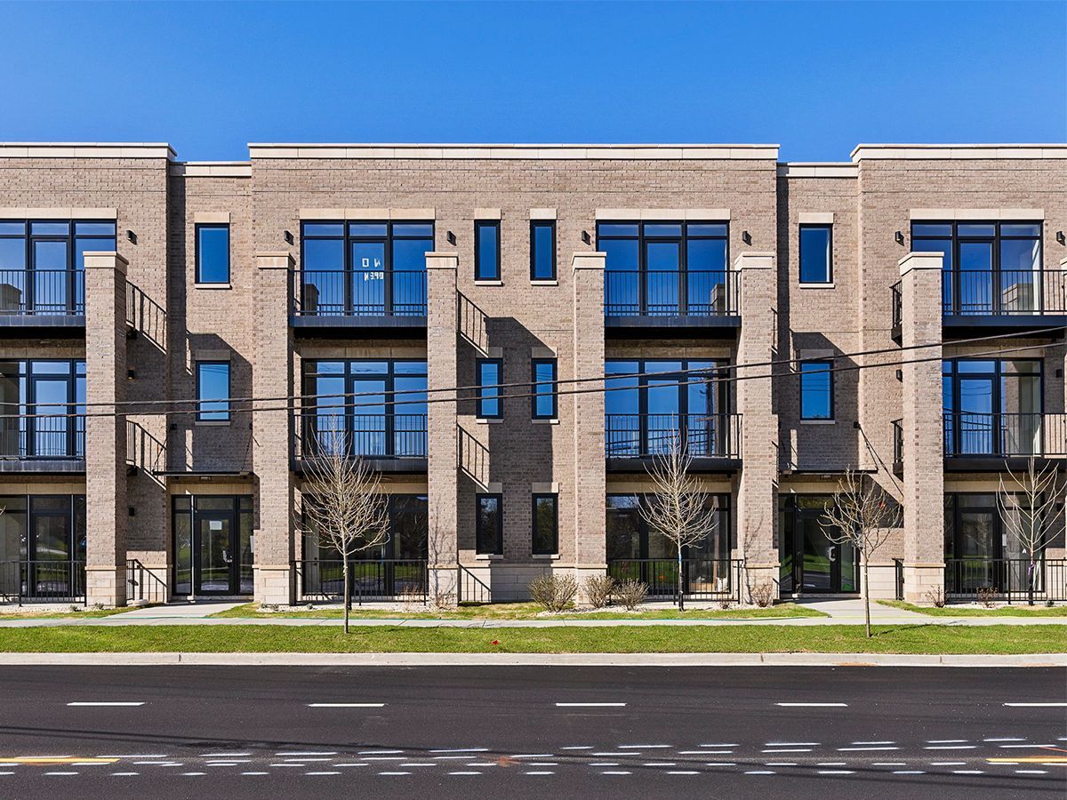 a brick building with a lot of windows and balconies