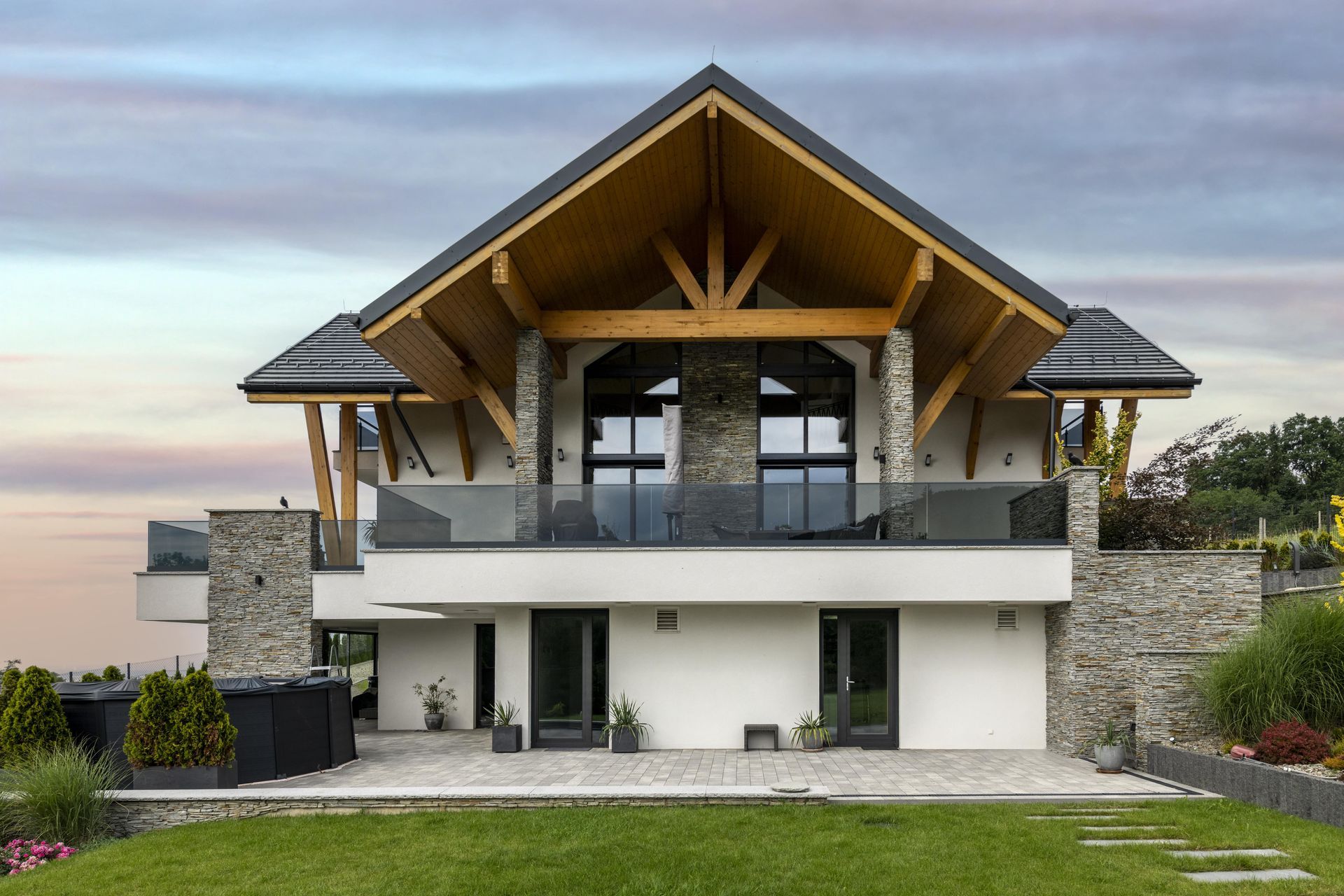a large white house with a wooden roof