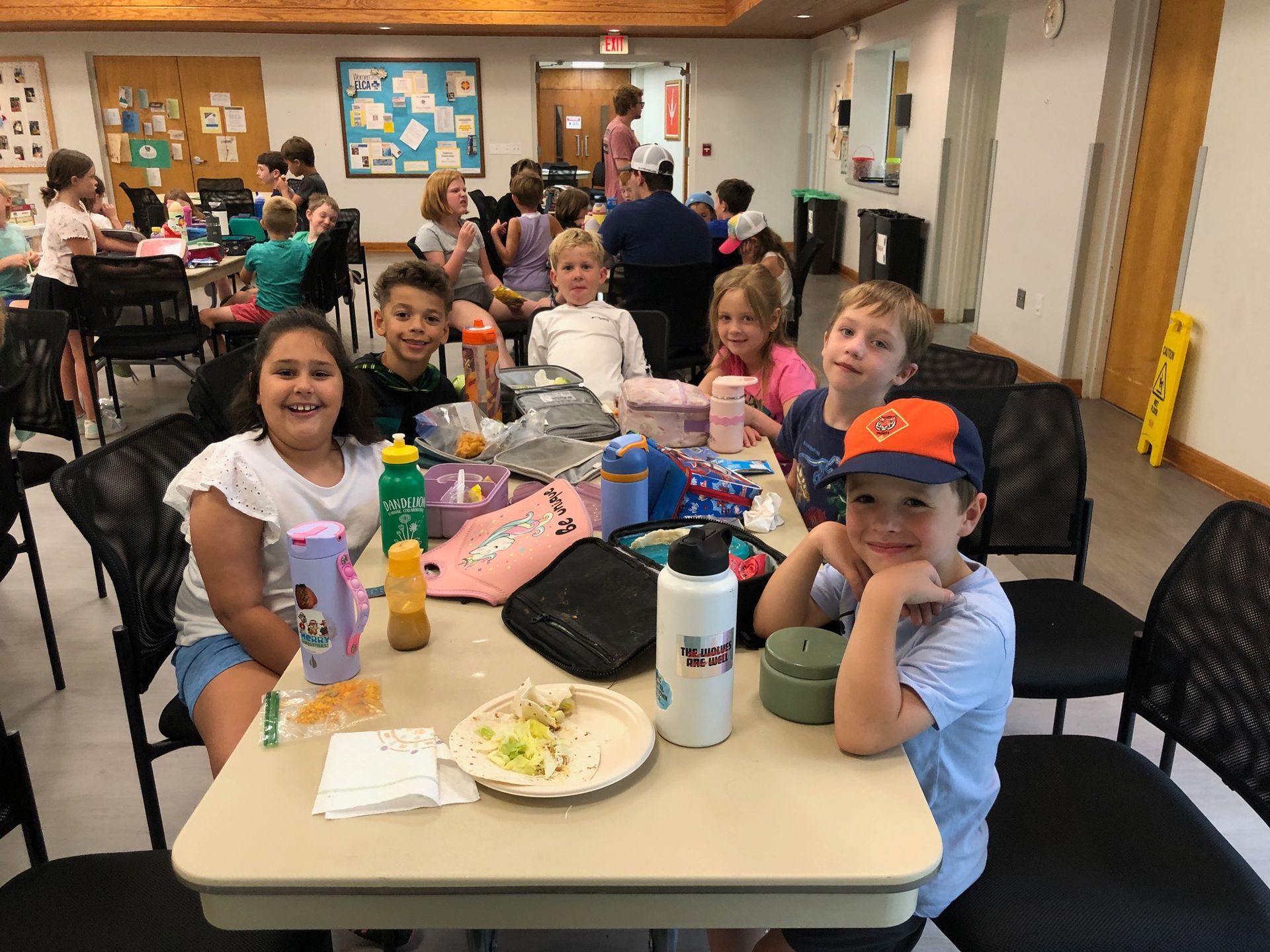 Kids enjoying lunch at Lutheroad decamp.