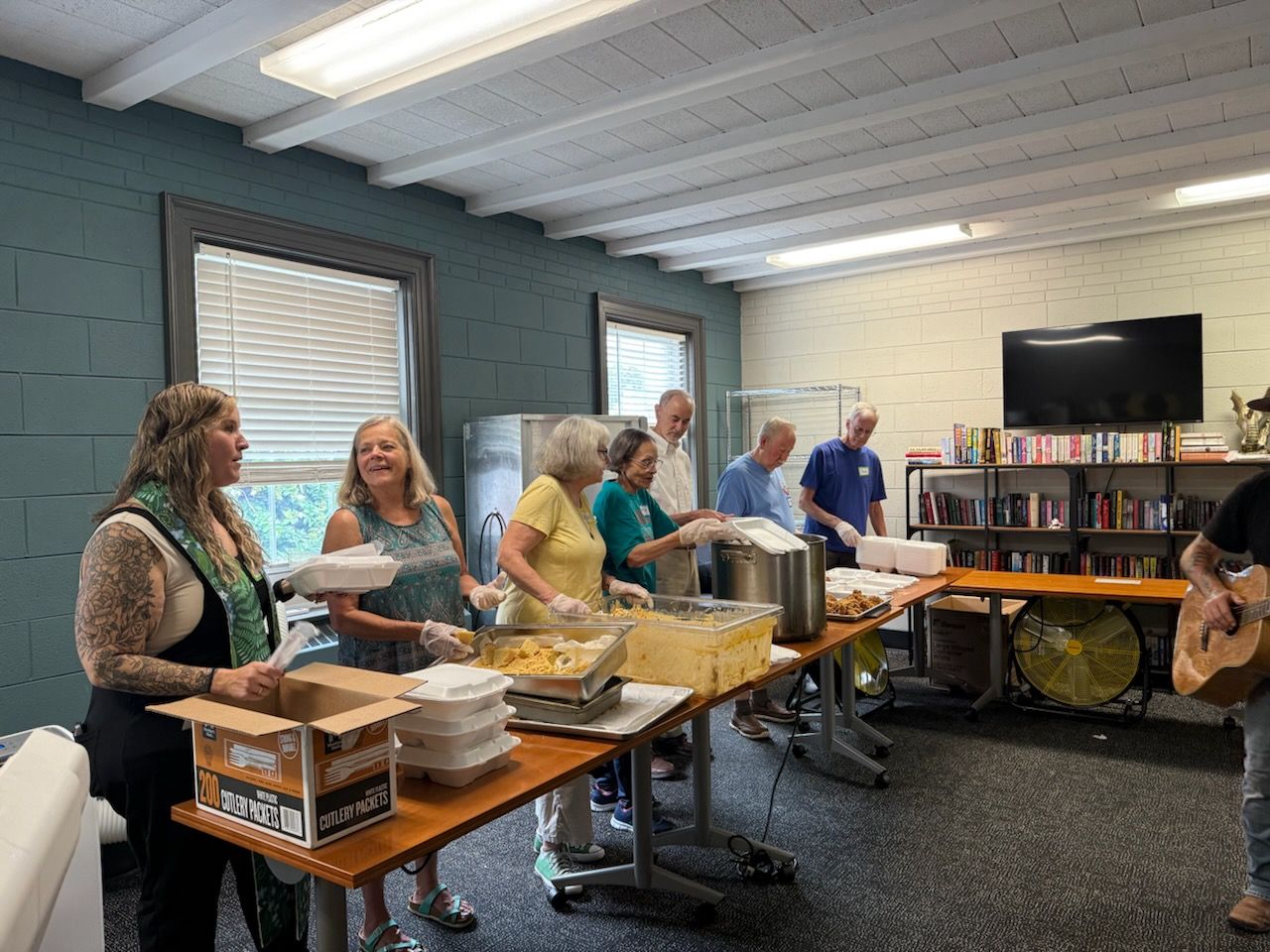 Serving a meal at the Dwelling with Pastor Emily.