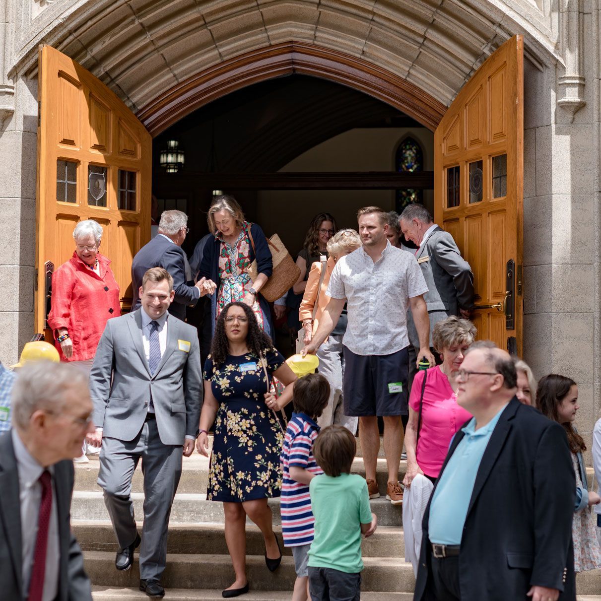 Congregation spills out the front doors after worship.