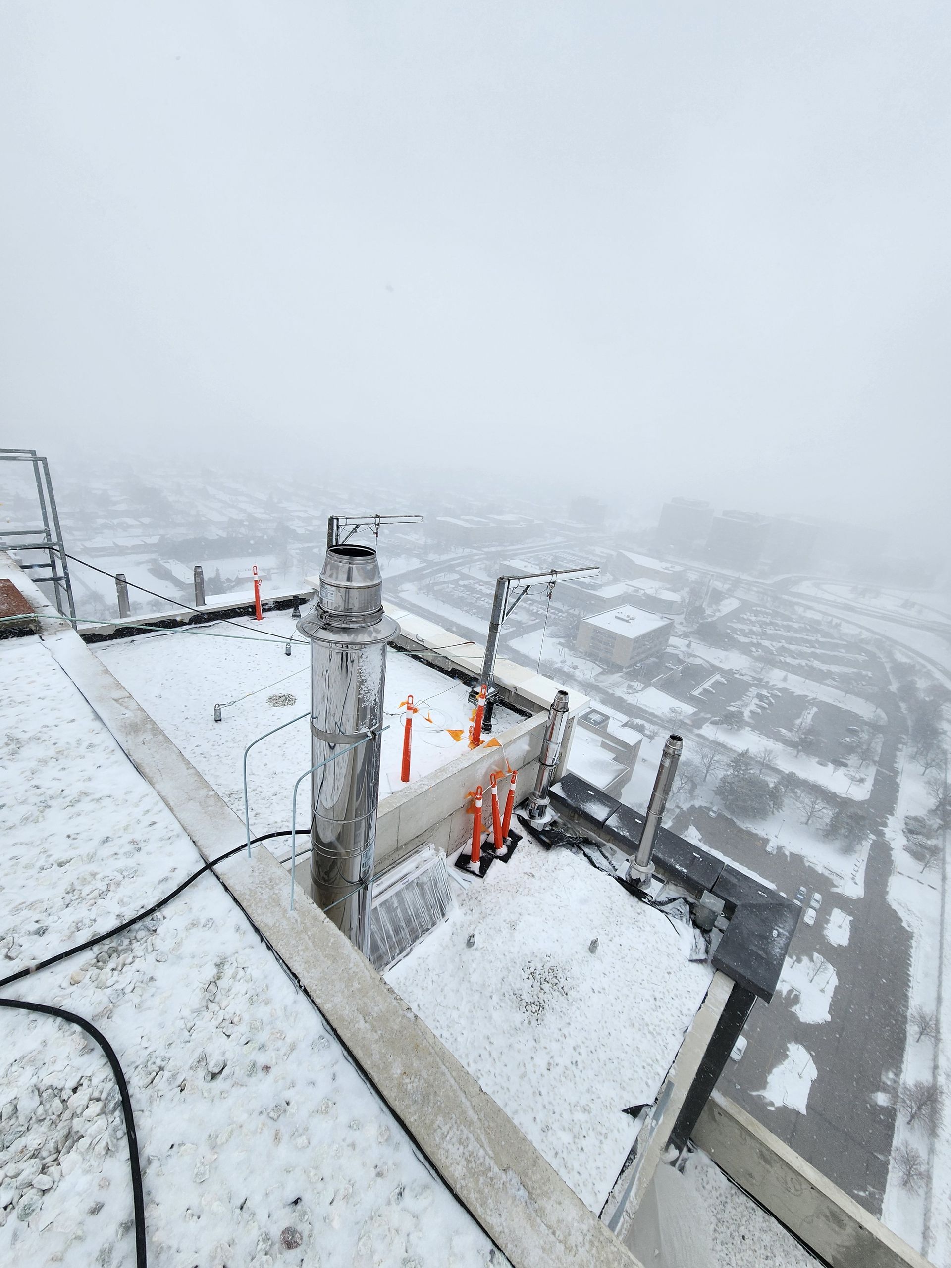 The roof of a building is covered in snow.