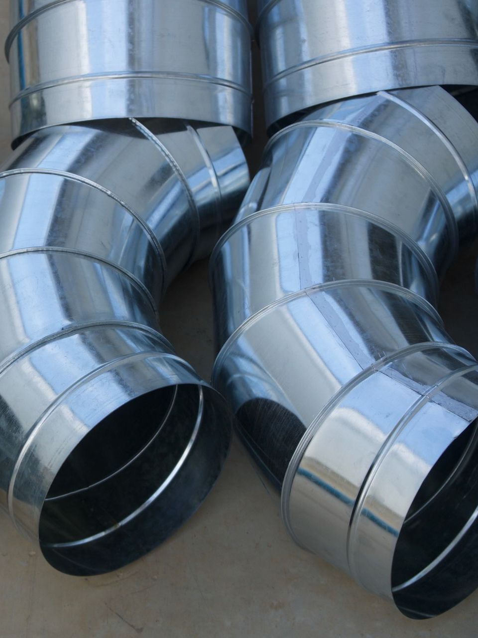 A bunch of metal pipes are stacked on top of each other